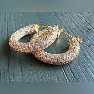 Gold tone 360 clear crystal pave hoop earrings